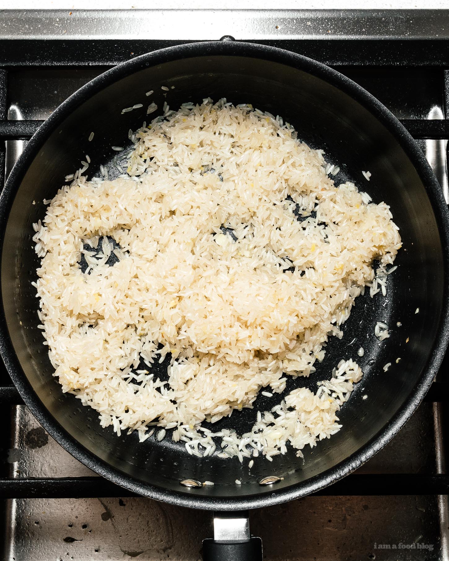 Super simple and satisfying Hainanese chicken rice: juicy steamed chicken and ginger garlic rice cooked in the same pot. It’s what you want for dinner, right now! #hainanesechickenrice #chickenrice #recipes #dinner #onepot #easy #chickenrecipe #rice #chickenandrice