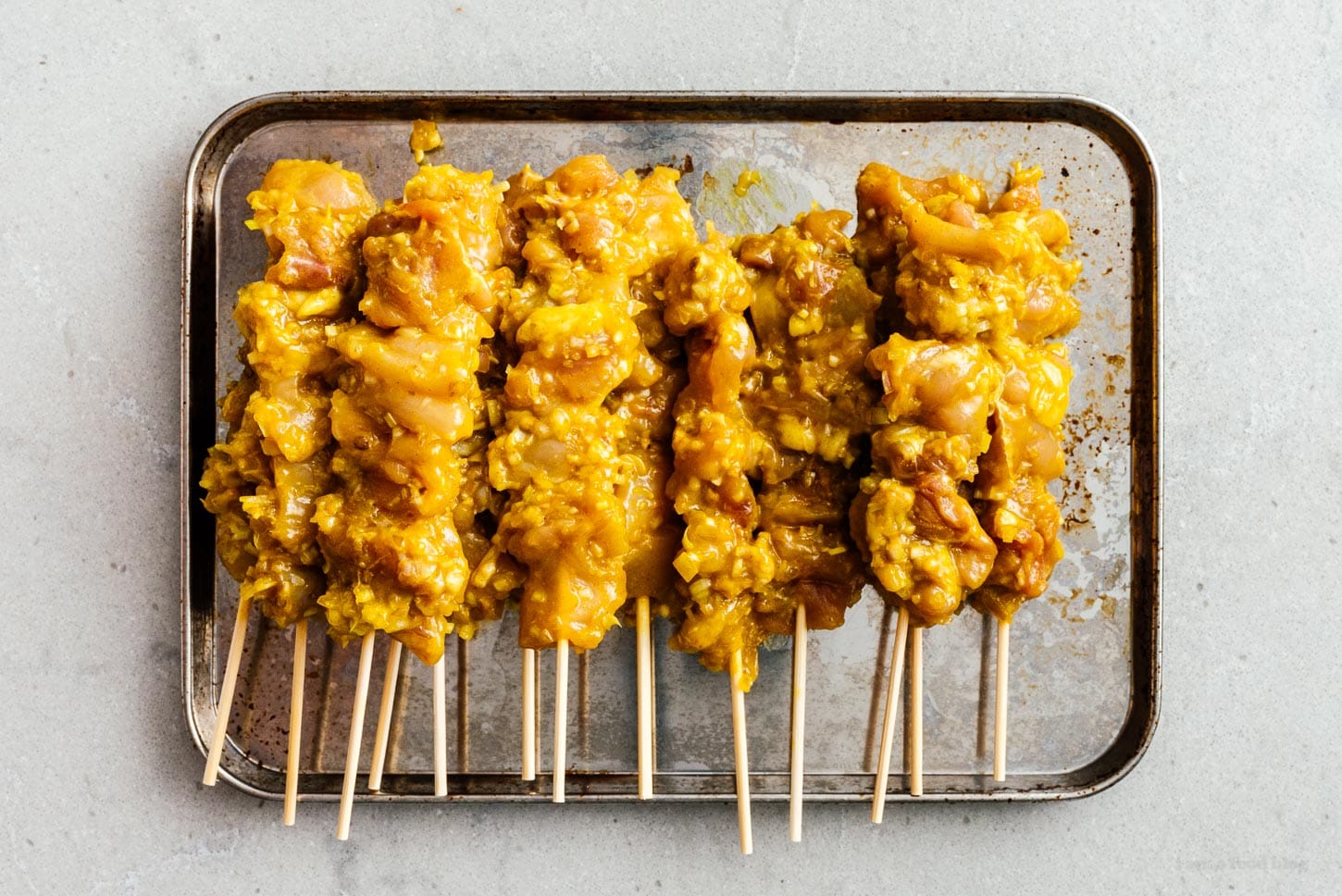 skewers of uncooked chicken satay | foodiesanddrink.com